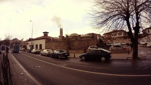 Smokes smoke from the Turkish bath evening road with cars Ankara Stock Footage