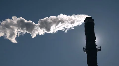 Smokestack Backlit by Sun. 動画素材 61043752