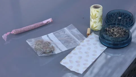 Smoking accessories for rolling a marijuana joint Video stock 344057530
