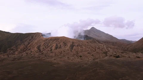 Smoking active volcano Mount Bromo located in Java, Indonesia. Stock Footage 86226275