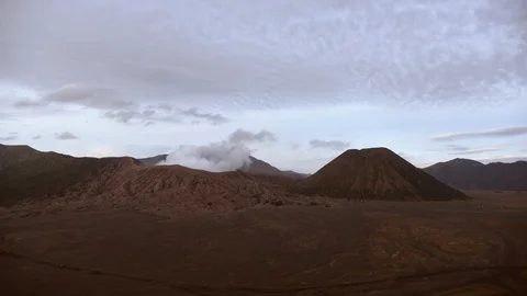 Smoking active volcano Mount Bromo located in Java, Indonesia. Stock Footage 86226503