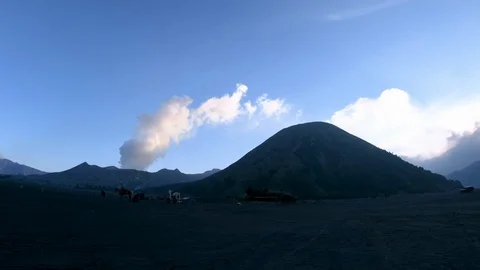 Smoking active volcano Mount Bromo located in Java, Indonesia. Stock Footage 86226548
