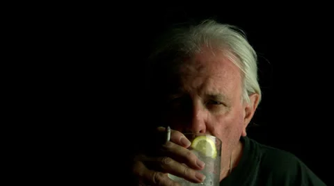 Smoking and drinking vodka or gin Stock Footage 39859749