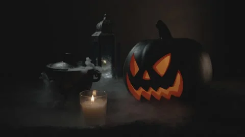 Smoking Boiling Cauldron with Lid Ajar near Jack-O-Lantern | Halloween Stock Footage 138330013