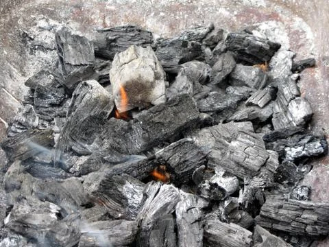Smoking burning charcoal Stock Photos