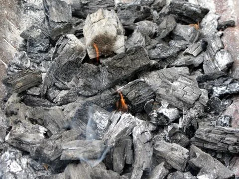 Smoking burning charcoal Stock Photos
