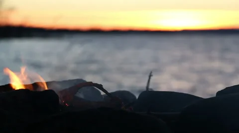 Smoking campfire at lakeside Stock Footage 44516779