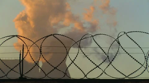 Smoking Chimney behind Barbed Wire Stock-Footage 58331043