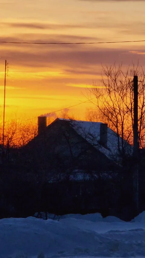 Smoking chimney on a house at sunset 스톡 동영상 337203240