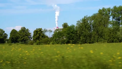 A smoking chimney in the landscape Stock Footage 164727607