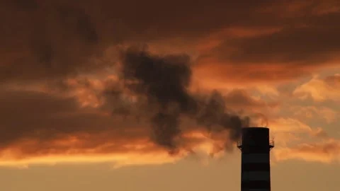 Smoking chimney at sunset, time-lapse. Stock Footage 326348604
