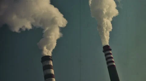 Smoking chimneys on an power plant factory.Vintage, old style look. Stock Footage 59792704