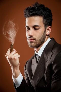Smoking cigar Stock Photos