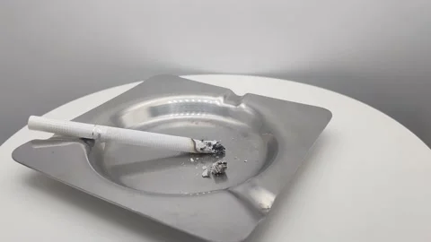 A smoking cigarette in an ashtray Stock Footage 167234242