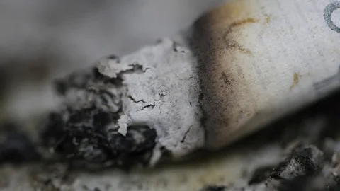 Smoking cigarette in the ashtray macro 4k Stock Footage 70596203