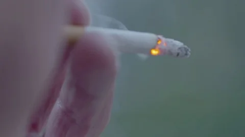 Smoking a cigarette close up Stock Footage 74118000