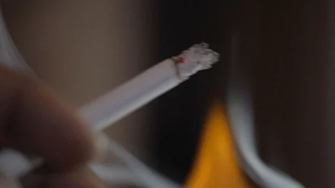 Smoking Cigarette with Fire background Stock Footage 90022398