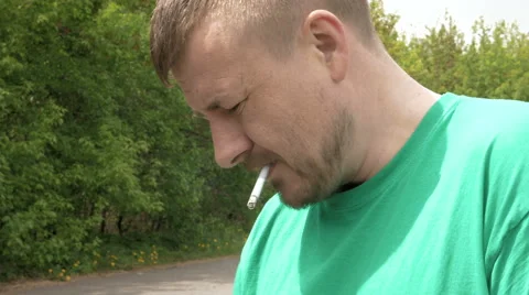 Smoking cigarette man portrait Stock Footage 63474370