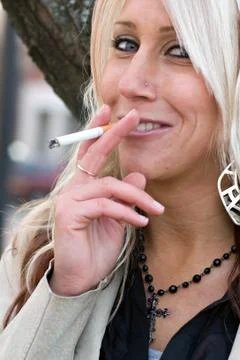 Smoking a Cigarette Stock Photos