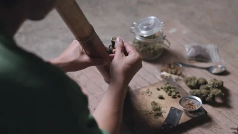 Smoking. Closeup shot of  man lighting a pipe of Marijuana. Man smokes ciga.. Stock Footage 336970807