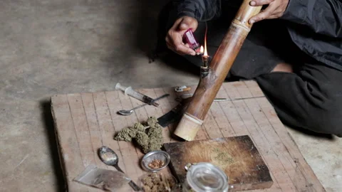 Smoking. Closeup shot of  man lighting a pipe of Marijuana. Man smokes ciga.. Stock Footage 336971183