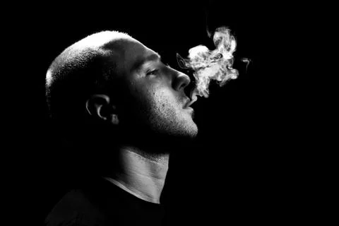 Smoking in the dark Stock Photos