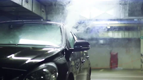 Smoking e-cigarette inside the black car Stock Footage 66218362