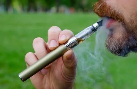 Smoking an electronic cigarette Stock Photos
