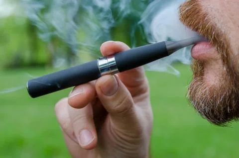 Smoking an electronic cigarette Stock Photos