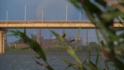 Smoking factory at sunset. Dramatic landscape at sunset. Factory with a smoking Stock-Footage 229459175