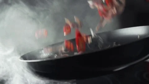 Smoking frying pan with vegetables, chef makes sauce, food cooking, vegetarian Stock Footage