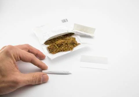 Smoking a handmade cigarette Stock Photos