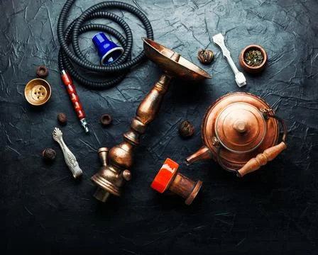 Smoking hookah with tea Stock Photos