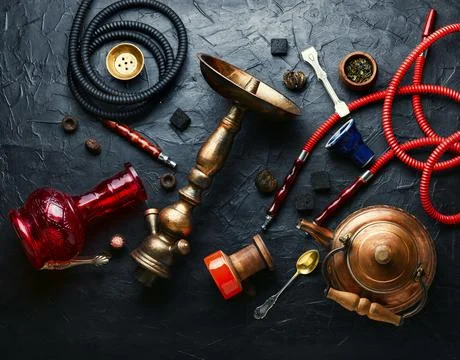 Smoking hookah with tea Stock Photos