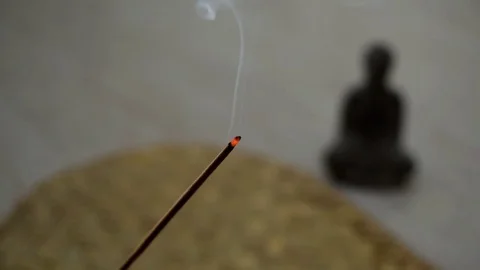 Smoking incense buddha statue Stock Footage 76928637