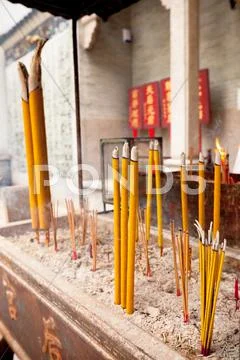 Smoking incense sticks at a temple in hong kong Stock Photos