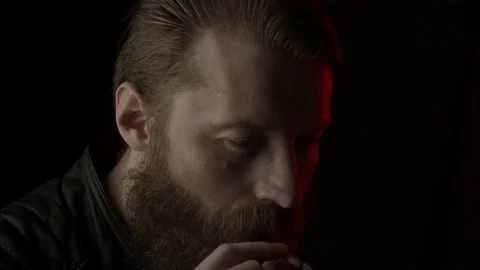 Smoking man on black Stock Footage 131665571