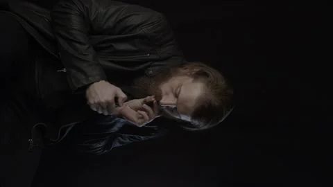 Smoking man on black. Vertical Video stock 131664225