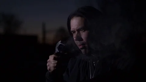 Smoking man in the dark. Slow motion Stock Footage 75268568