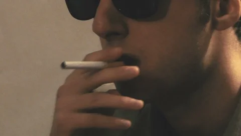 Smoking Man with Sunglasses Close-up Video stock 87205050