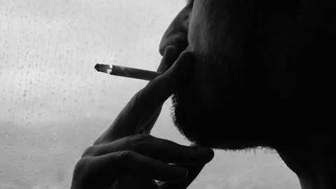 Smoking man by the window 스톡 동영상 128915434