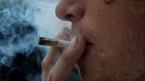 SMOKING MARIJUANA JOINT Video stock 93009621