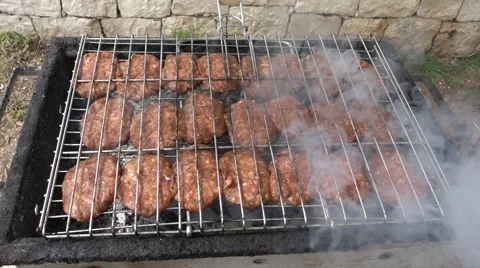 Smoking meat balls on grill Stock Footage 62193166