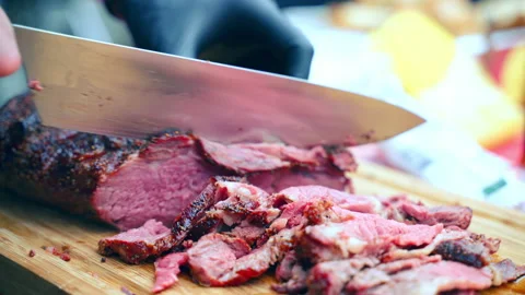 Smoking medium rare grilled beef sirloin sliced on wooden cutting board Stock-Footage 157613480