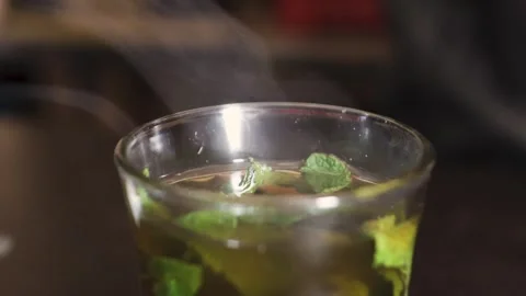 A smoking mint tea, recently made Stock Footage 243572718