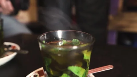 A smoking mint tea, recently made Stock Footage 243572733