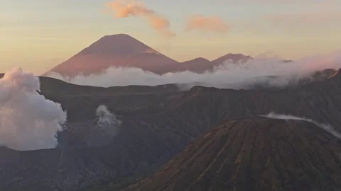 Smoking mount bromo volcano during an ethereal indonesian sunrise Stock Footage 328915583