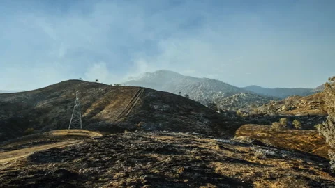 Smoking mountain landscape after a destructive wildfire Видео 332963391