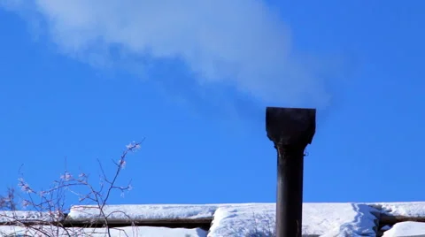 Smoking old chimney on the backdrop of clear blue sky Видео 1067727