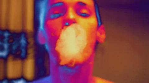 Smoking rings narcoman defocus Stock Footage 54670605